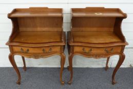 Pair of mahogany bedside cabinets made in the French style, with cross banding, carved floral detail