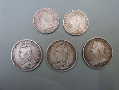Five Victorian silver coins including three crowns (1890, 1892 and 1893) and two half crowns (1887