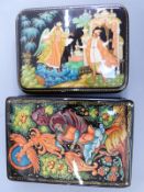 Two Russian lacquer boxes, one with decoration of a phoenix ascending, signed (approximately 13cm