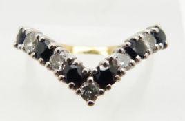 An 18ct gold ring set with sapphires and diamonds in a V shaped setting, 3.3g, size N