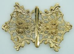 A silver gilt buckle with cut out rose decoration