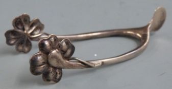White metal novelty wishbone sugar nips with shamrock or four leaf clover grips, marked sterling,
