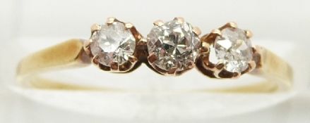 An 18ct gold ring set with three diamonds,1.7g, size M