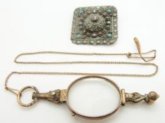 A lorgnette and a silver brooch