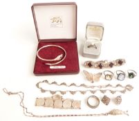 A collection of silver jewellery including rings, marcasite necklace, snake bangle etc