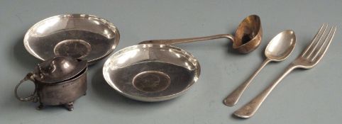 Two coin based pin dishes marked silver, three pieces of hallmarked silver cutlery and a