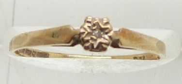 A 9ct gold ring set with a diamond, 1.2g, size O