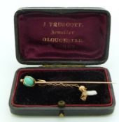 A 9ct gold stick pin set with a turquoise sphere and a drop section set with a pearl, in vintage