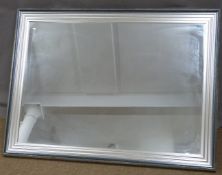 A large rectangular mirror with silver frame, 91 x 122cm overall