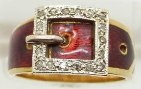 An 18ct gold ring set with red enamel and diamonds in the form of a buckle, with receipt, 7.8g, size