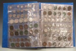 An amateur collection of coins in an album, includes Victorian silver content