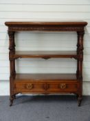 Victorian oak three tier what-not with two drawers under, the ornately carved columns leading to