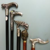 Five walking sticks with various ornamental handles
