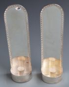 A pair of Walter Vernon modern feature hallmarked silver wall mounted candle sconces, London 1999