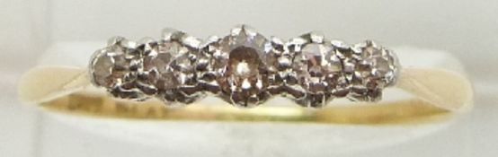An 18ct gold ring set with five diamonds, 2.7g, size W