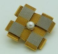 Yellow and white metal mesh brooch set with a pearl to the centre, 11.7g, 2.5cm