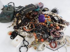 A collection of costume jewellery including two silver pendants, silver earrings, necklaces etc