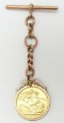 A 1913 gold full sovereign in 9ct rose gold fob setting, 14.1g