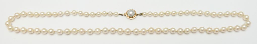 A single strand of cultured pearls with gold clasp set with a further pearl