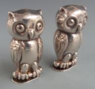 Novelty salt and pepper shakers, each formed as owls with hinged bases, height 5.5cm