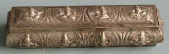 Thai or Nepalese white metal trinket box with embossed seated figures, length 13.5cm weight 96g