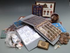 An amateur collection of coins, some in albums, some silver content