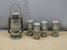 Four Wolf Safety Lamp Co. miner's or similar lamps and a hurricane lamp height excluding handle