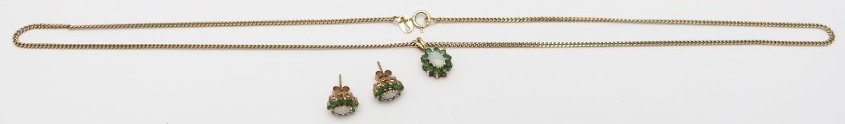 A 9ct gold necklace set with an opal and emeralds, with matching earrings, 7.6g