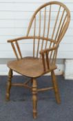 A bespoke elm seated Windsor stick back armchair with crinoline under stretcher, 108cm high