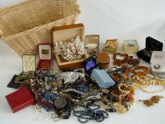 A collection of costume jewellery including amber beads, agate necklace, ivory beads, silver bangle,