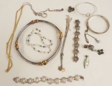 A collection of silver jewellery including a necklace with gilt sections, earrings, necklaces,
