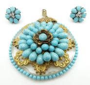 A continental pendant set with faux turquoise and gilt decoration and a pair of silver earrings