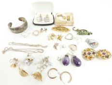 A collection of jewellery including Butler and Wilson brooch, silver bangle, pearl earrings,