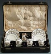 Cased set of George V hallmarked silver mounted Aynsley coffee cups and saucers, Birmingham 1924,