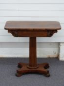 Victorian rosewood side table with octagonal column and pad feet
