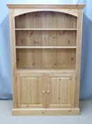 Set of pine shelves with cupboards below, W122 x D35 x H183cm