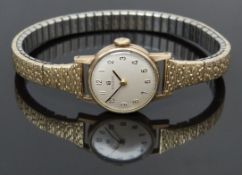 Tissot 9ct gold ladies wristwatch ref. 17009-48 with black hands, blued Arabic numerals, cream