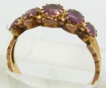 A 9ct gold ring set with garnets, 2.3g, size R