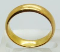 A 22ct gold wedding band, size N, 6.7g.