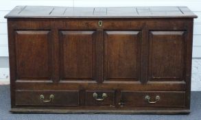 19thC oak coffer/chest with four fielded panel front and set with three drawers to base, each with a