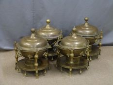 Four decorative brass covered warmers, diameter 45cm