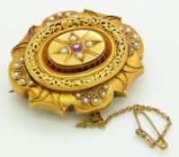 Victorian mourning brooch set with a ruby and seed pearls, with glass compartment verso, 4 x 3.5cm