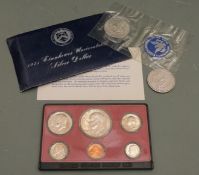 1898 US Liberty dollar together with 1971 Eisenhower 40% silver example in folder pack and a 1974 US