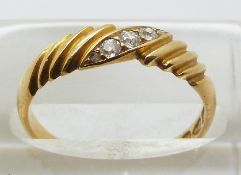 An 18ct gold ring set with five diamonds, Chester 1893, size O, 2.9g