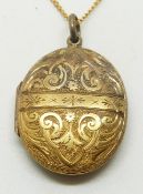 Victorian engraved locket on a 9ct gold chain, 3 x 2.5cm, 7.5g