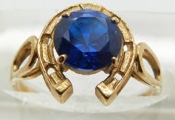 A 9ct gold ring set with paste in a horseshoe setting, size L, 1.8g.