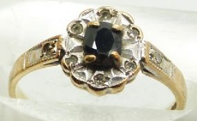 A 9ct gold ring set with a sapphire and diamonds, 1.6g, size K