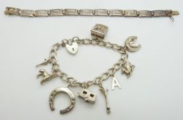 A silver Greek key bracelet and silver charm bracelet