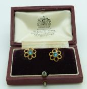 A pair of 9ct gold earrings set with a round cut zircon to each, in Asprey box
