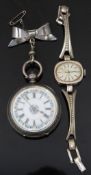 Continental silver open faced pocket watch with gold hands, black Roman numerals, floral decorated